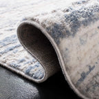 SAFAVIEH Amelia Collection Area Rug - 9' x 12', Ivory & Blue, Modern Abstract Design, Non-Shedding & Easy Care, Ideal for High Traffic Areas in Living Room, Bedroom (ALA768A)