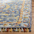 SAFAVIEH Aspen Collection Area Rug - 9' x 12', Blue & Rust, Handmade Boho Braided Tassel Wool, Ideal for High Traffic Areas in Living Room, Bedroom (APN116M)