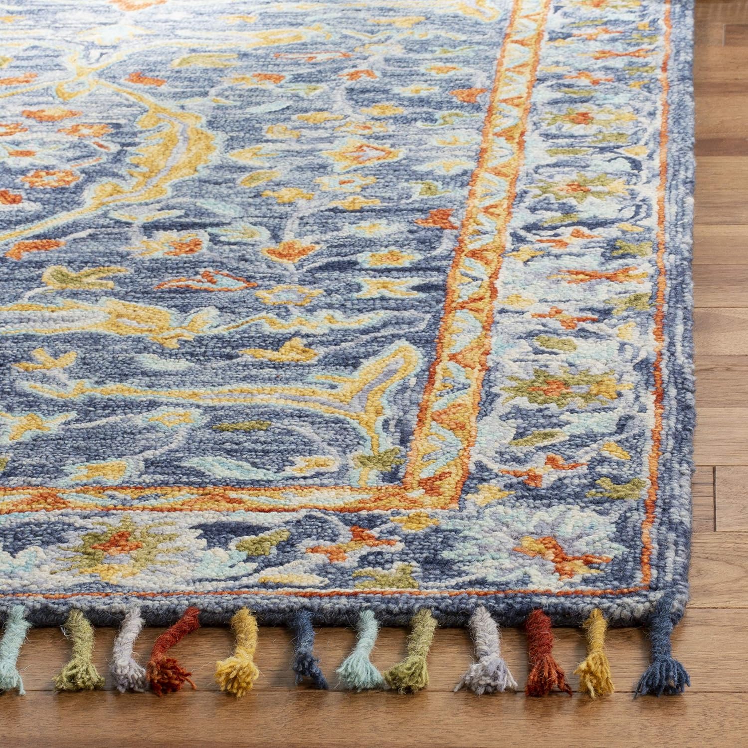 SAFAVIEH Aspen Collection Area Rug - 9' x 12', Blue & Rust, Handmade Boho Braided Tassel Wool, Ideal for High Traffic Areas in Living Room, Bedroom (APN116M)