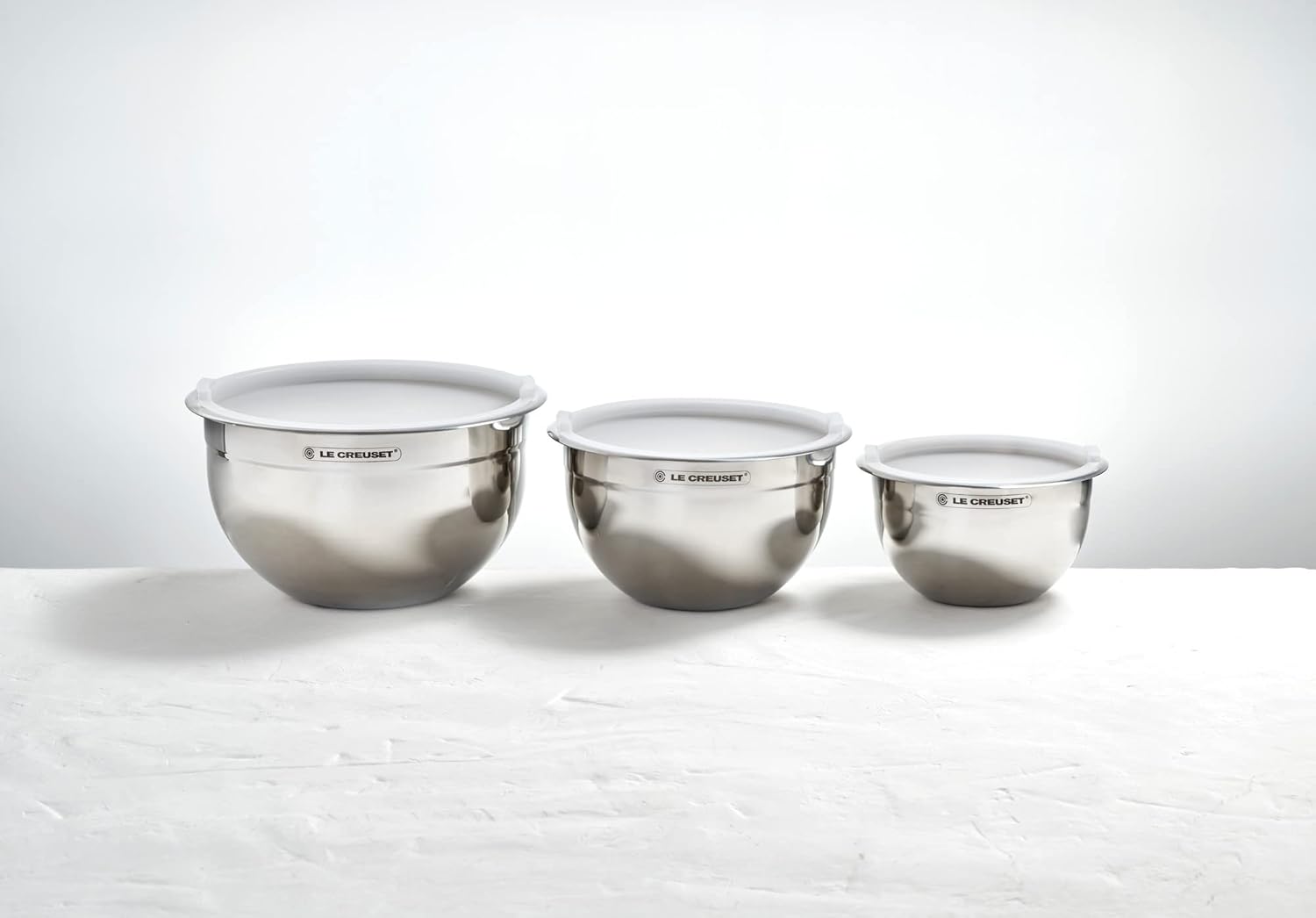 Le Creuset Set of 3 Nested Mixing Bowls w/Nonslip Silicone Base & Plastic Air Tight Lids