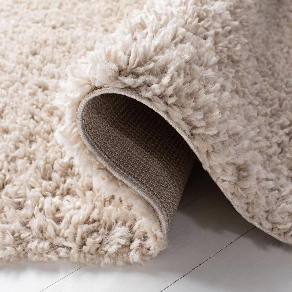 SAFAVIEH August Shag Collection Area Rug - 9' x 12', Beige, Solid Design, Non-Shedding & Easy Care, 1.5-inch Thick Ideal for High Traffic Areas in Living Room, Bedroom (AUG200D)