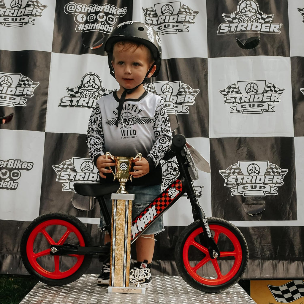 Strider 12” Sport Bike - No Pedal Balance Bicycle for Kids 1 to 4 Years - Includes Safety Pad, Padded Seat, Mini Grips & Flat-Free Tires - Tool-Free Assembly & Adjustments