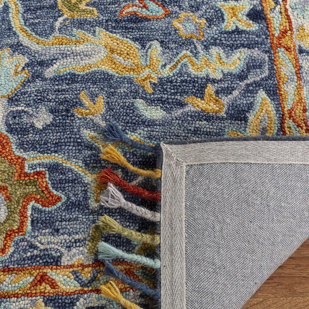 SAFAVIEH Aspen Collection Area Rug - 9' x 12', Blue & Rust, Handmade Boho Braided Tassel Wool, Ideal for High Traffic Areas in Living Room, Bedroom (APN116M)