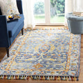 SAFAVIEH Aspen Collection Area Rug - 9' x 12', Blue & Rust, Handmade Boho Braided Tassel Wool, Ideal for High Traffic Areas in Living Room, Bedroom (APN116M)